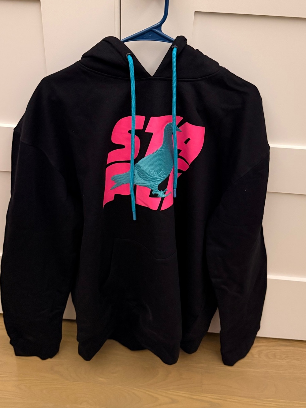 Staple Black Hoodie with Teal Drawstrings and Pink Logo
